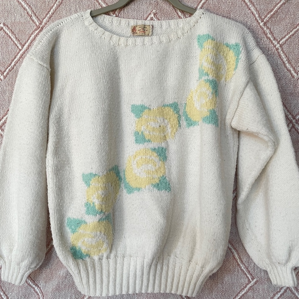 Vintage sweater with floral print on the front.